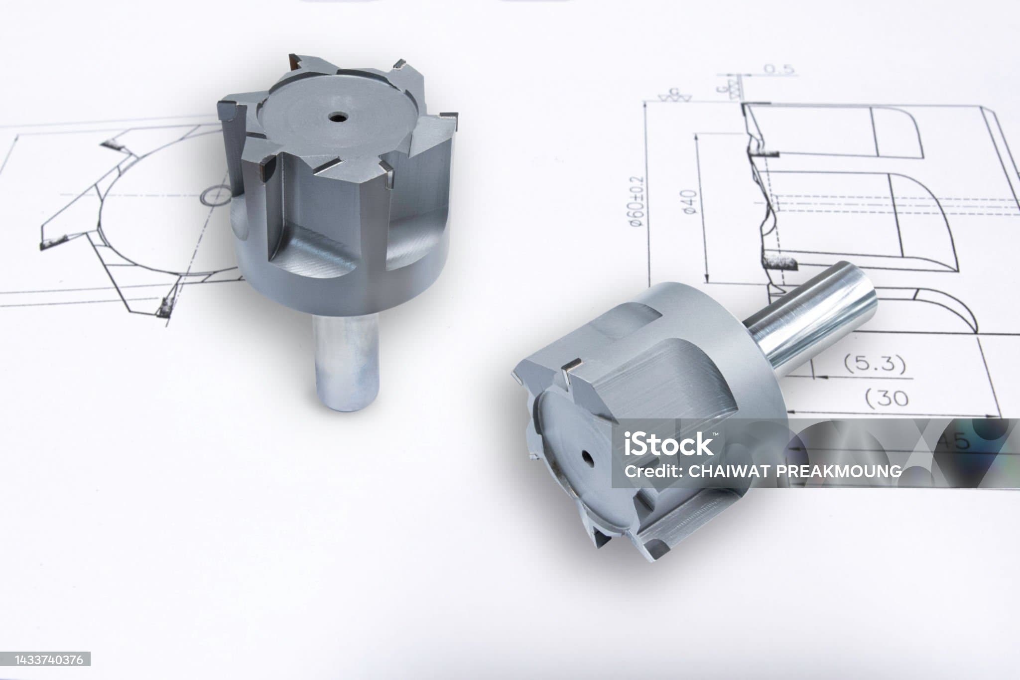 Macro view of a metallic drill tip showing sharp edges and detailed machining features up close